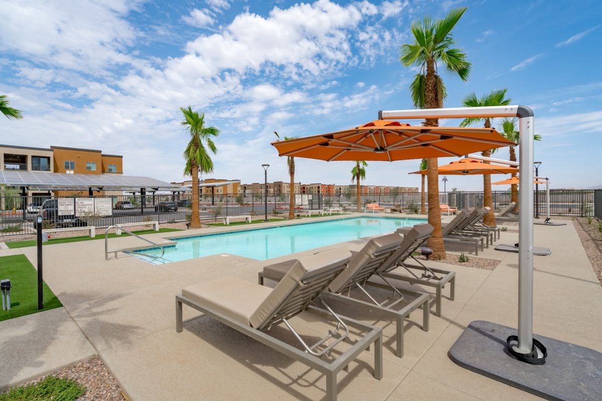 Outdoor Pool with Green Space at Alma Apartments in Casa Grande, AZ